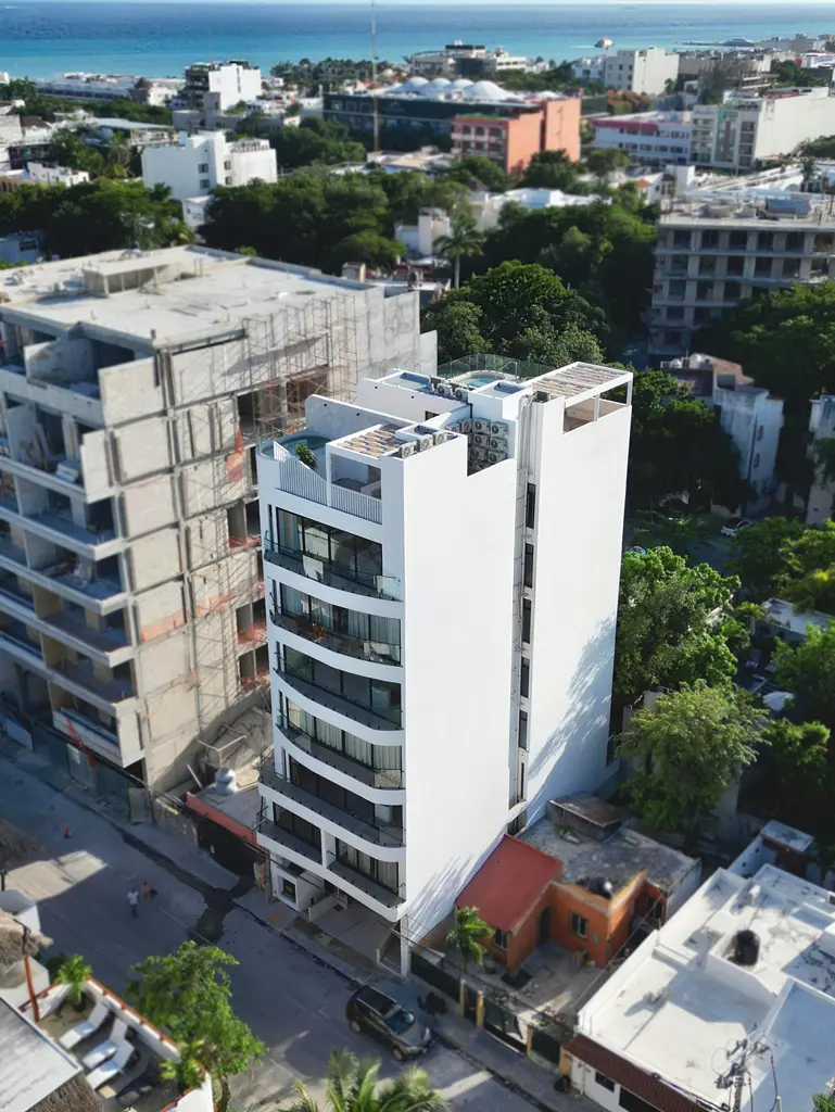 Aerial view of Luna Residences in central Playa del Carmen, with the Caribbean behind